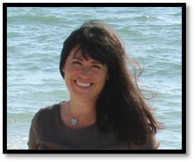 A person smiling at the cameraDescription automatically generated